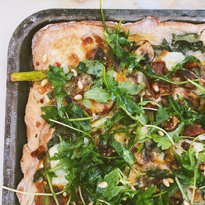 HOMEMADE PIZZA WITH BURRATA & SUN-DRIED TOMATO, ROCKET, PINE NUT TOPPING